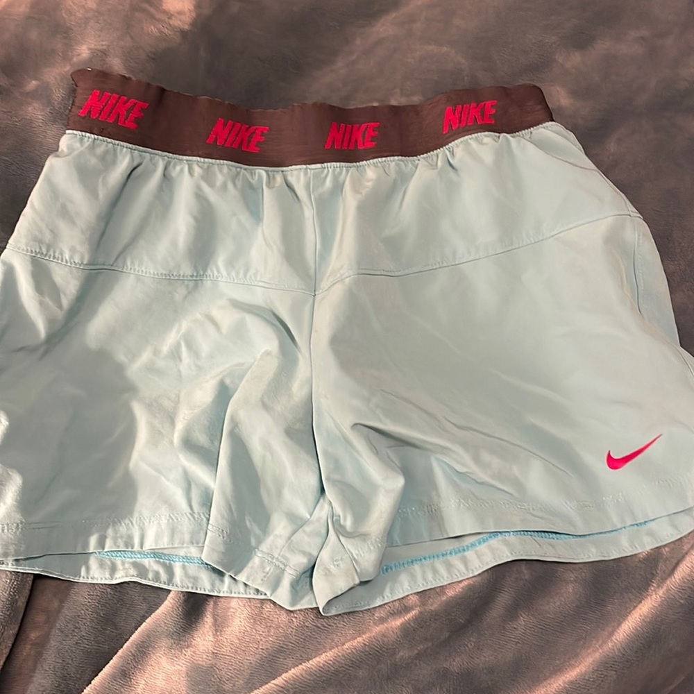 Blue Nike running shorts with built in spandex